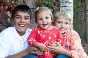 Happy adoptees in a loving adoptive family