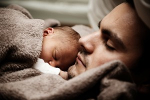 baby sleeping on dads chest