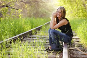 Young woman on railroad