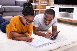 Hopeful adoptive family filling out adoption paperwork