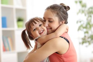 Birthmom hugging her daughter who was adopted