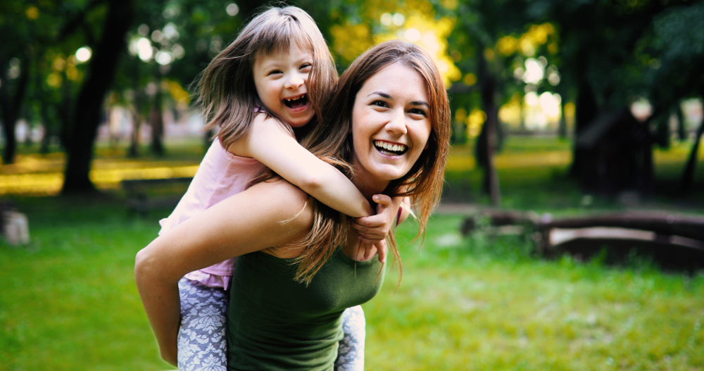 Little girl with special needs enjoy spending time with mother See less