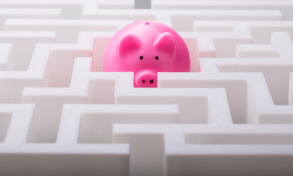 Close-up Of Pink Piggybank In The Centre Of White Maze