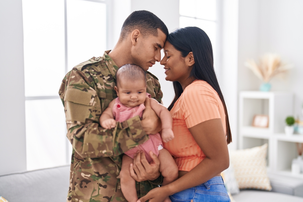 Hispanic family army soldier hugging each other at home