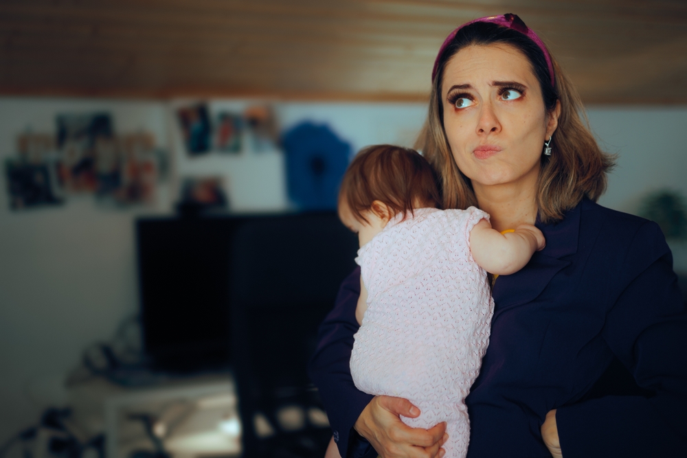 Puzzled Businesswoman Having No free Time as a New Mom Busy mom and freelance worker feeling overwhelmed with responsibilities