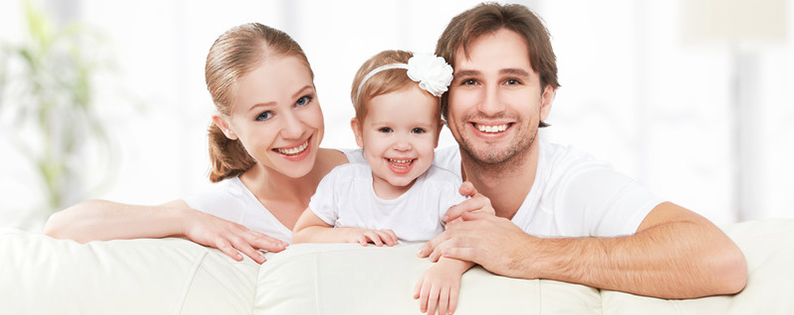adoptive family with their baby girl