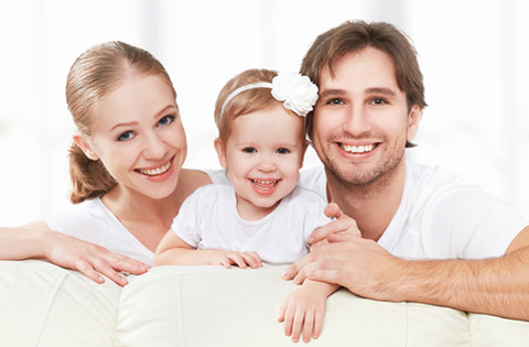 adoptive family with their baby girl